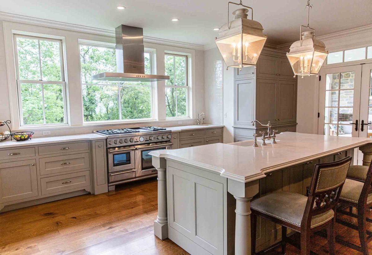 A kitchen with a large island and a stove