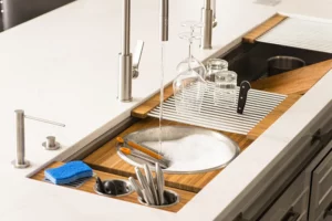 A Galley Workstation shown on a white kitchen island and sold by Laslo Custom Kitchens.