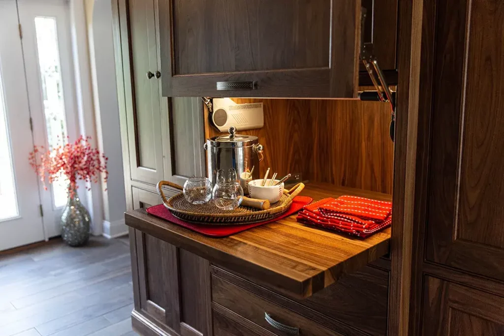 Built In dark natural wood stained cabinets paired with the classic door style and crown molding.