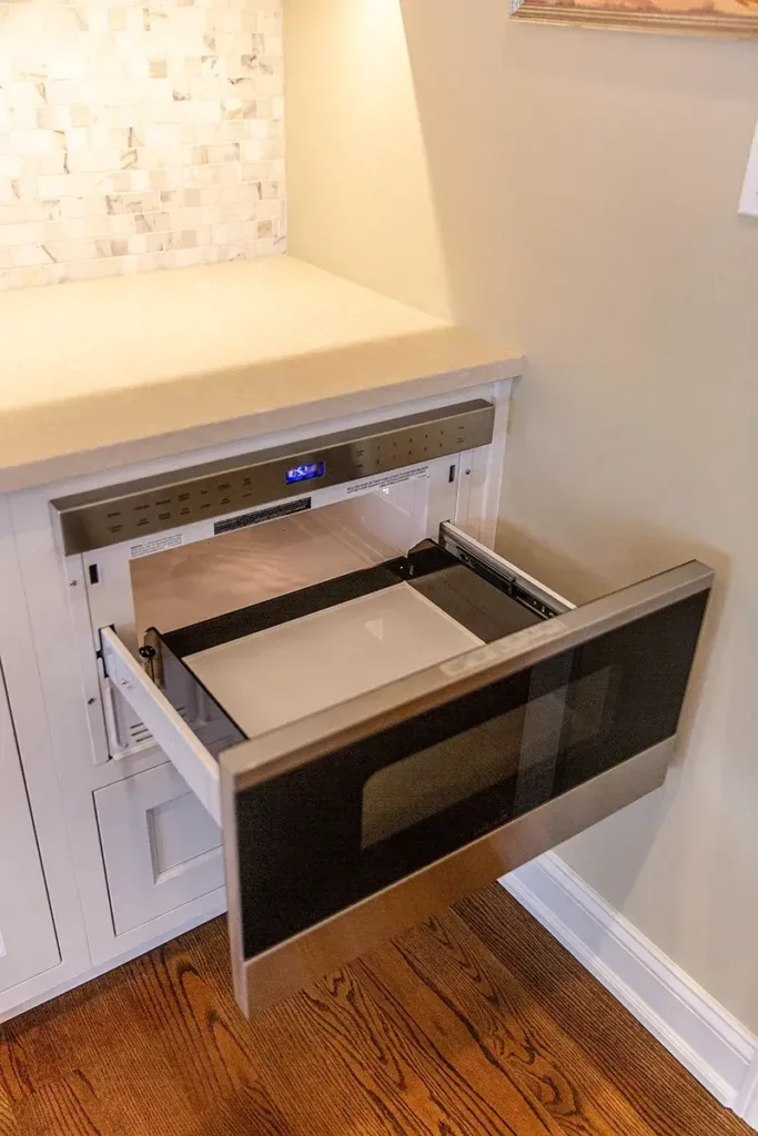 Custom pullout microwave drawer in kitchen