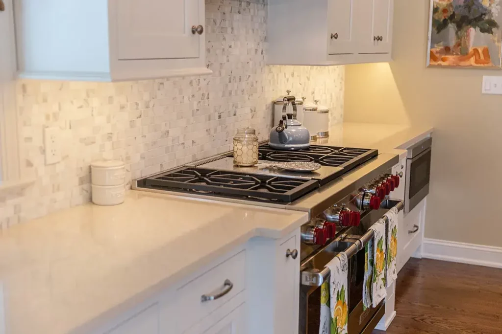 White custom kitchen with American range stove