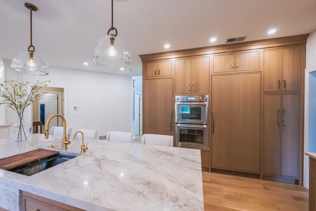 Benjamin Moore Cloud Cover paint provides a fresh, bright foundation for the hood, larder cabinet, and pantry.