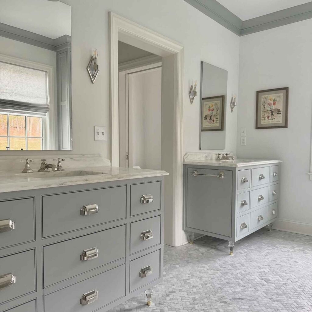 Bathroom with Blue Springs vanities, slab fronts, and designer-selected countertops and legs.