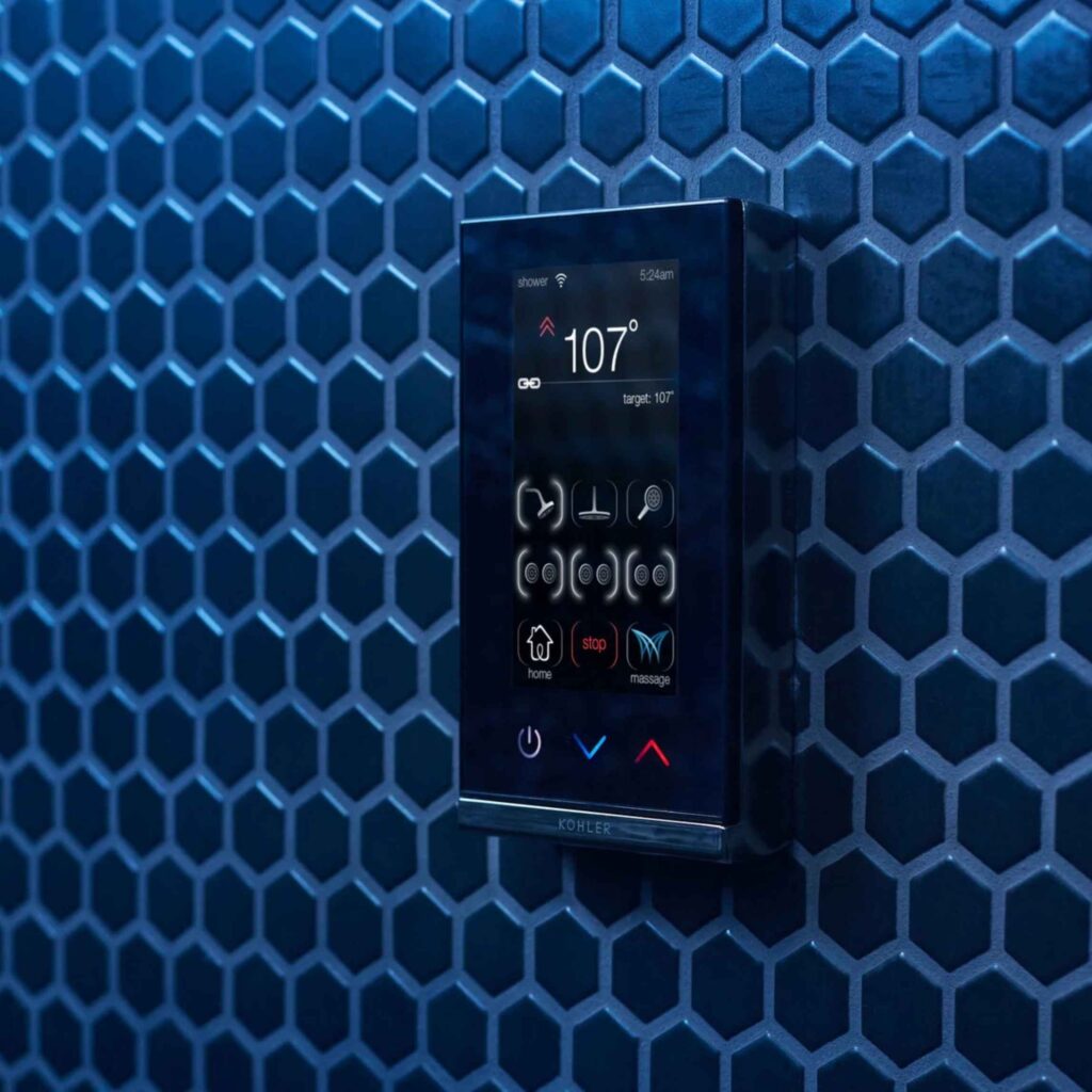 Smart shower technology on blue tile.