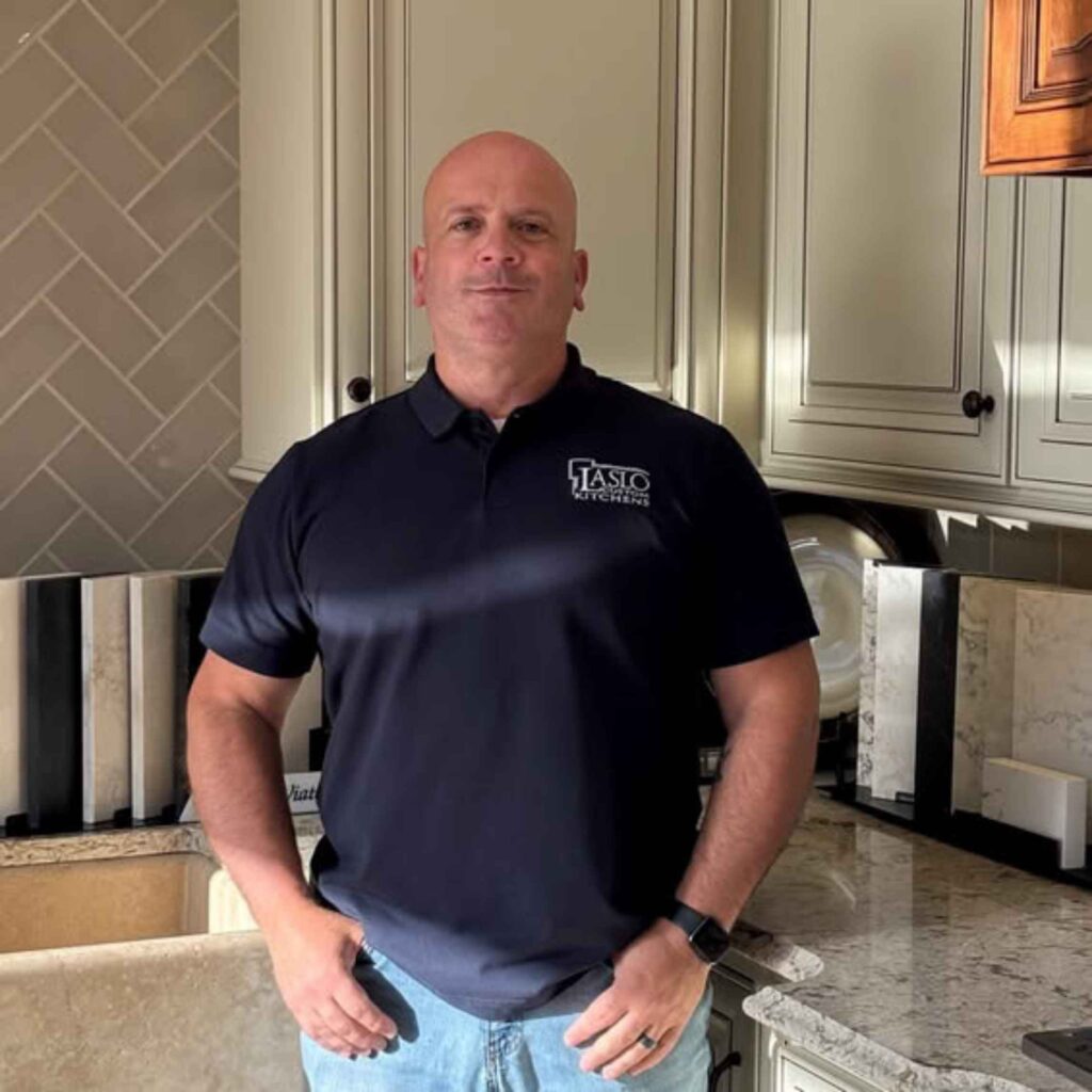A man with a navy shirt stands in the Laslo showroom.