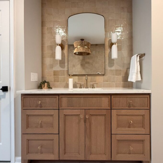 rift cut oak reeded vanity with herringbone marble floor and hand made backsplash tiles