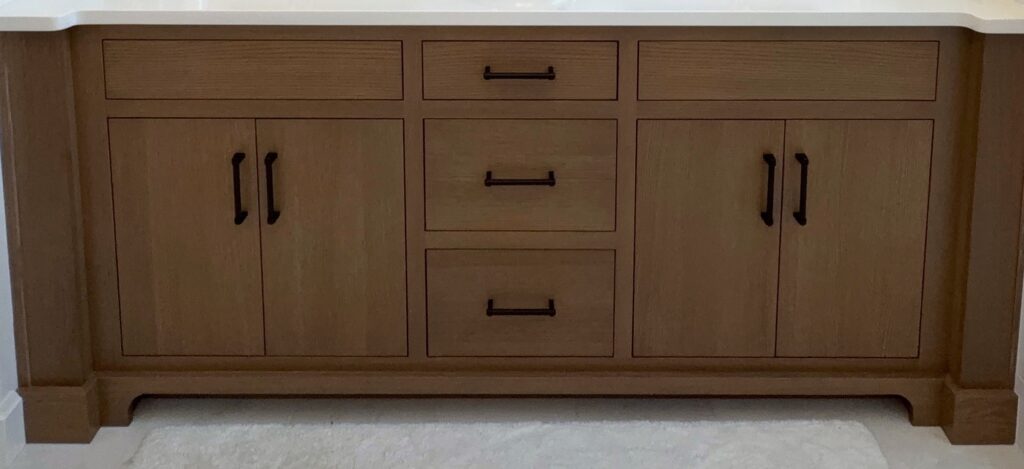 close up of top knobs hardware on a Double vanity with flush inset white rift cut oak cabinetry in Bethlehem PA