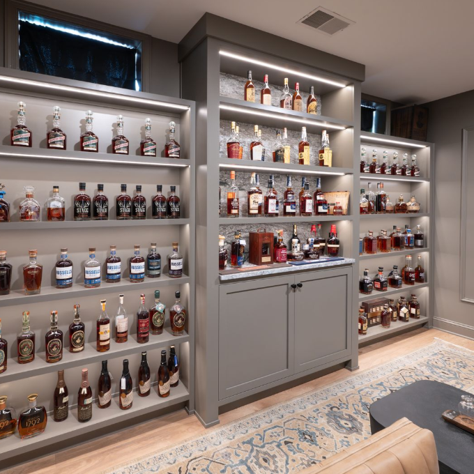 A view of the completed whiskey bar in Center Valley, PA featuring Blue Dunes granite countertops with custom millwork.