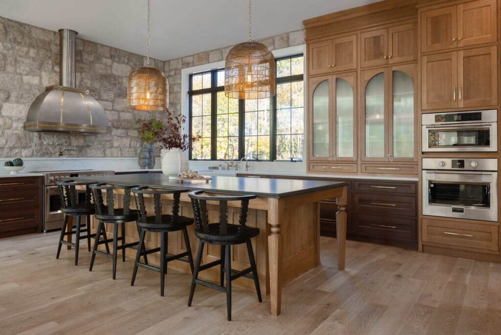 Custom wood kitchen island in Emmaus, PA with an integrated sink, seating, and coordinating natural wood cabinetry.