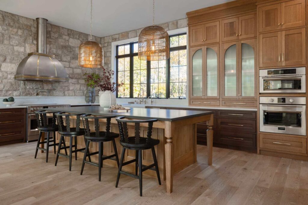 Custom kitchen cabinetry in Emmaus, PA featuring walnut and quarter-sawn white oak, beaded inset construction, and an expansive center island.